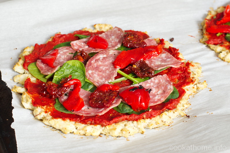 This cauliflower pizza crust is a gluten-free carrier for pizza toppings, but a crispy pizza crust it isn't! #pizza