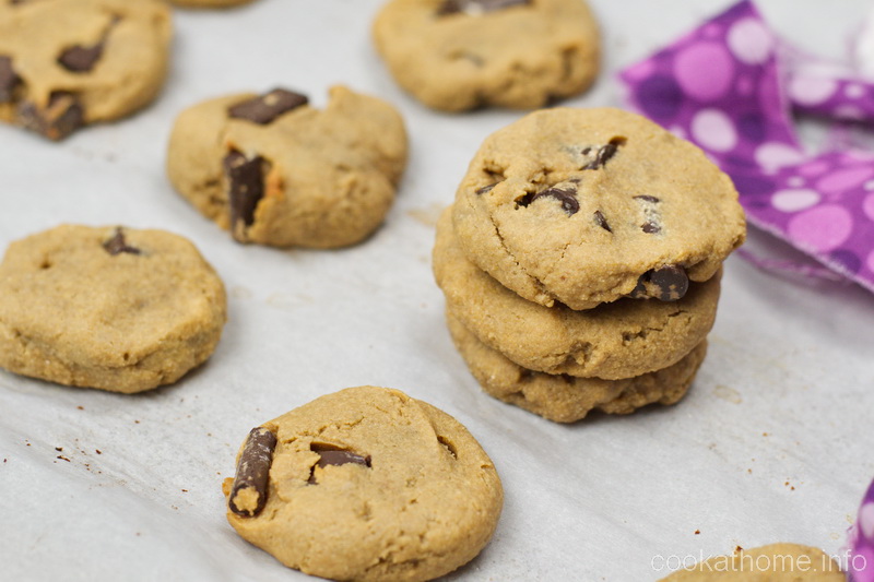 This gluten and dairy free chickpea peanut butter cookie recipe is a completely different texture to most chocolate chip cookies - but oh so yummy! #chickpea